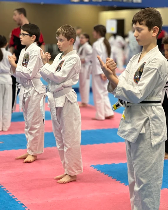 Youth students standing in line showing discipline during Greece NY karate class.